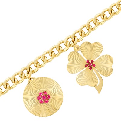 Lot 391 - Rose Gold and Ruby Charm Bracelet
