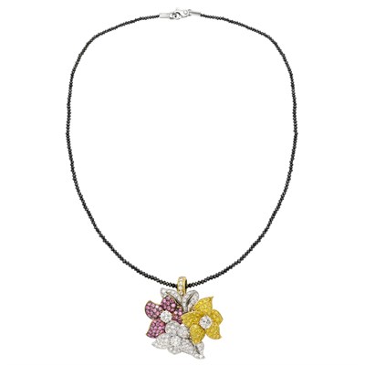 Lot 450 - Tricolor Gold, Diamond and Colored Diamond Floral Brooch-Pendant with Black Diamond Bead Chain
