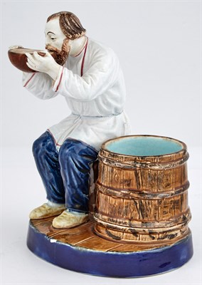 Lot 123 - Russian Glazed Pottery Figure of a Peasant...