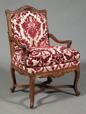 Lot 1155 - Régence Style Walnut and Parcel-Gilt Armchair...