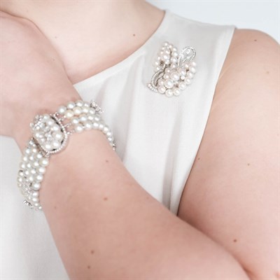 Lot 58 - Four Strand White Gold, Cultured Pearl and Diamond Bracelet, Pair of Earrings and Pendant-Brooch
