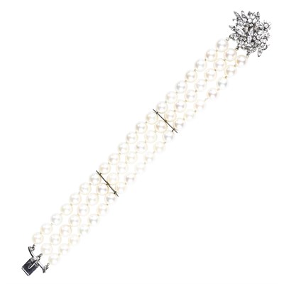 Lot 231 - Triple Strand Cultured Pearl, White Gold and Diamond Bracelet