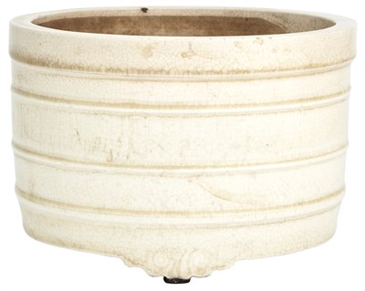 Lot 249 - A Chinese Cream Glazed Earthenware Tripod...