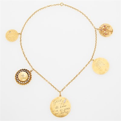 Lot 59 - CELESTE HOLM Gold and Gold Charm Necklace. 14...