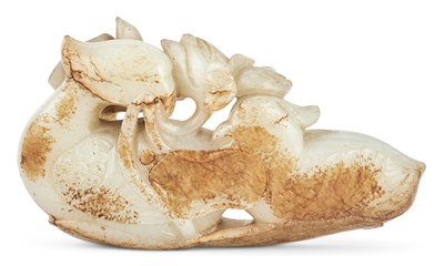 Lot 21 - A Chinese Celadon and Russet Jade Carving of...