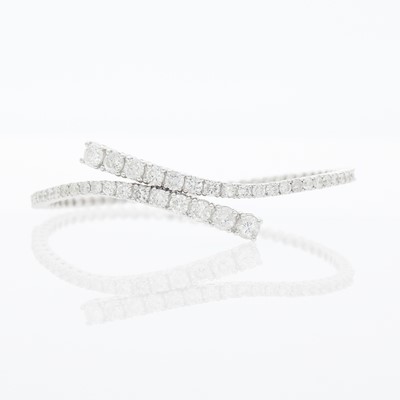 Lot 1167 - White Gold and Diamond Crossover Bracelet