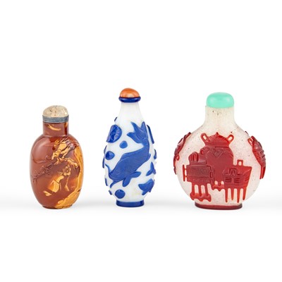 Lot 41 - A Chinese Realgar and Two Glass Overlay Snuff Bottles
