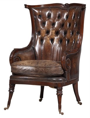 Lot 760 - Regency Tufted Leather and Mahogany Wing Chair...