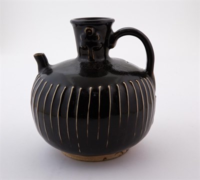 Lot 181 - A Chinese Cizhou Black Glazed Ribbed Ewer