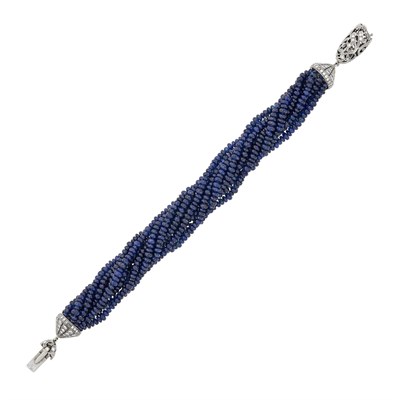Lot 92 - Ten Strand Sapphire Bead Torsade Bracelet with White Gold and Diamond Clasp
