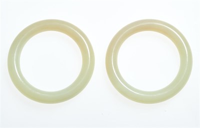 Lot 74 - A Pair of Chinese White Jade Bangles