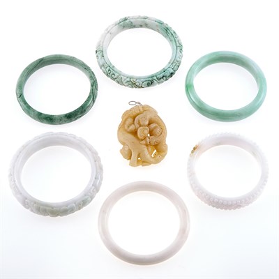 Lot 1273 - Six Jade Bangle Bracelets and Carved Jade Pendant