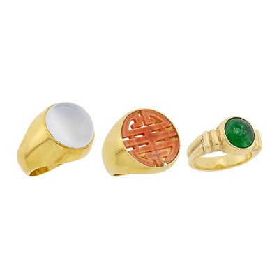 Lot 229 - Three Gold, Moonstone, Carved Coral and Cabochon Emerald Ring