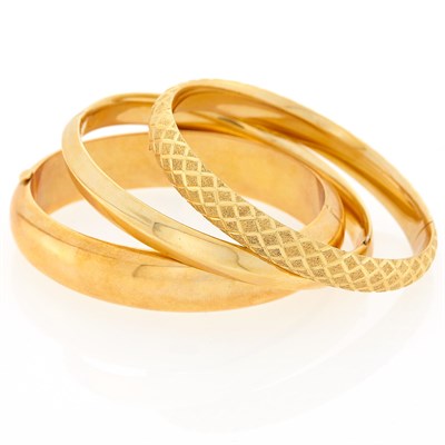Lot 1244 - Three Gold Bangle Bracelets
