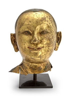 Lot 70 - A Tibetan Gilt Copper Repousse Head of an Attendant