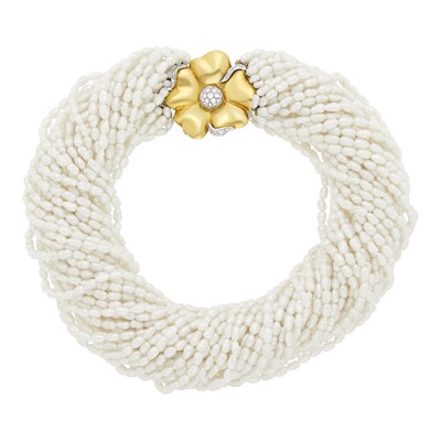 Lot 1010 - Thirty-Four Freshwater Pearl Torsade Necklace with Two-Color Gold and Diamond Flower Clasp