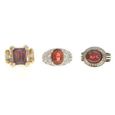 Lot 2176 - Three White and Yellow Gold, Garnet and Diamond Rings