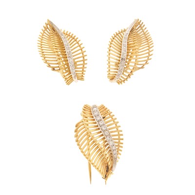 Lot 1129 - Pair of Two-Color Gold and Diamond Earclips and Clip-Brooch