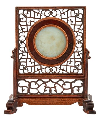 Lot 23 - A Chinese White Jade Disc