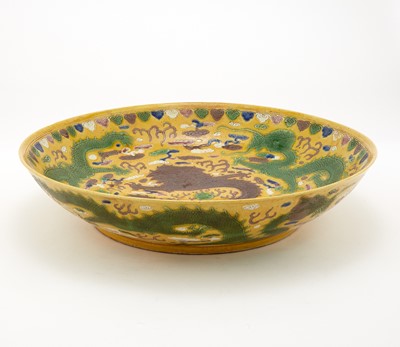 Lot 391 - A Chinese Yellow Ground Porcelain Dragon Charger