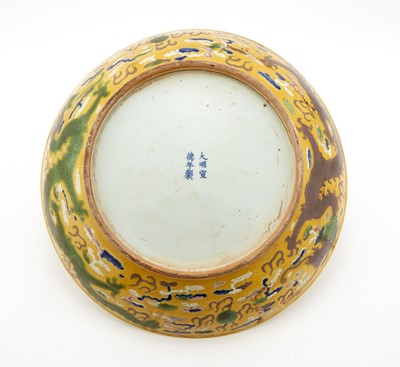 Lot 391 - A Chinese Yellow Ground Porcelain Dragon Charger