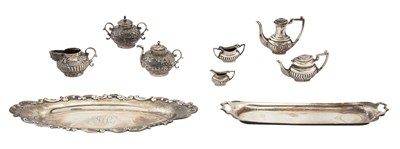 Lot 235 - Two Miniature Silver Part Tea Services