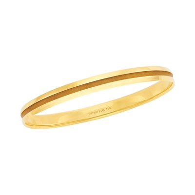 Lot 2016 - Tiffany & Co. Gold 'Atlas' Bangle Bracelet