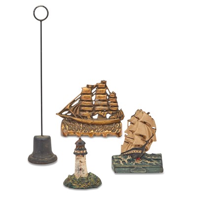 Lot 167 - Three Cast Iron Door Stops and a Composite Door Stop