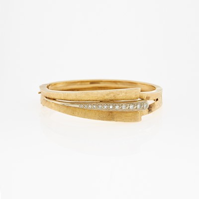 Lot 1100 - Two-Color Gold and Diamond Bangle Bracelet