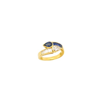 Lot 1043 - Oscar Heyman & Brothers Gold, Sapphire and Diamond Crossover Ring