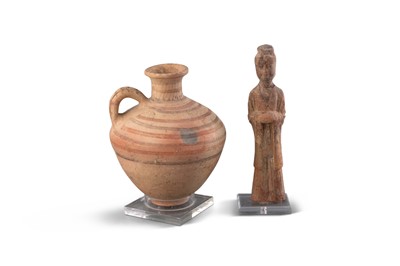 Lot 1087 - A Chinese Unglazed Pottery Figure