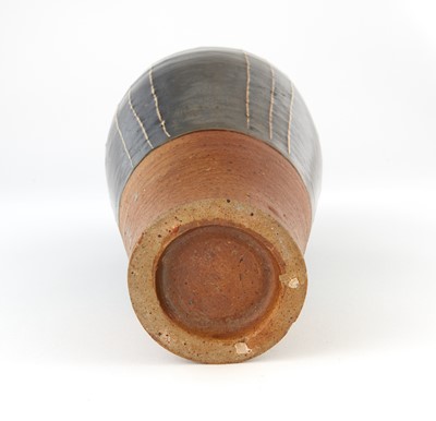 Lot 311 - A Chinese Cizhou Black Glazed Ribbed Vase