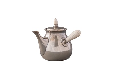 Lot 1115 - Tuttle Sterling Silver Jensen-Style Teapot