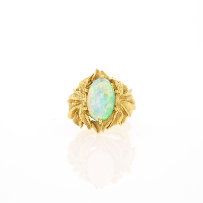 Lot 1183 - Gold and White Opal Ring