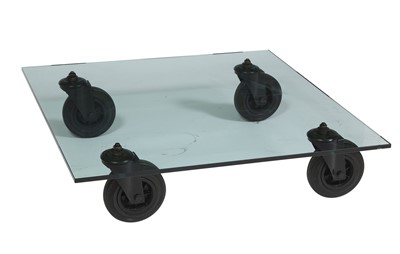 Lot 607 - Gae Aulenti for Fontana Arte Glass, Metal and Rubber "Tavolo Con Ruote" Coffee Table