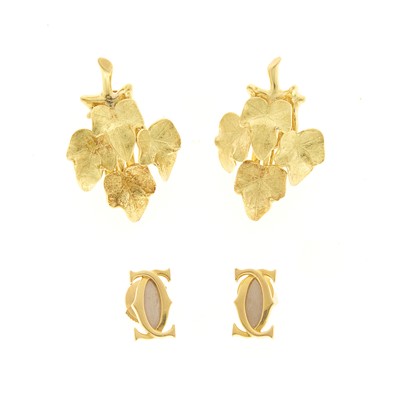 Lot 1196 - Cartier Pair of Two-Color Gold 'Double C' Stud Earings and Pair of Leaf Earrings