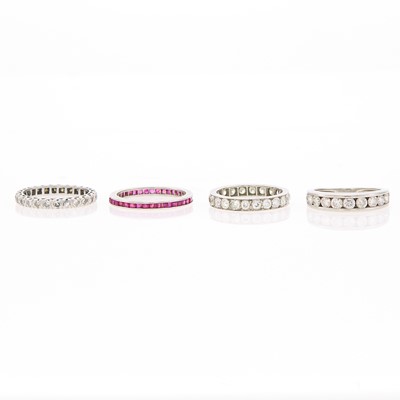 Lot 1072 - Three Platinum and Diamond Band Rings and Ruby Band Ring