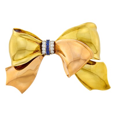 Lot 210 - Cartier Two-Color Gold, Platinum, Sapphire and Diamond Bow Brooch