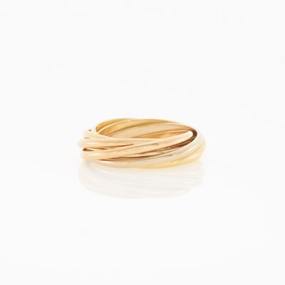 Lot 2003 - Cartier Tricolor Seven Row Gold 'Trinity' Rolling Band Ring, France