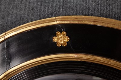 Lot 357 - Regency Style Parcel-Gilt Ebonized Convex Mirror