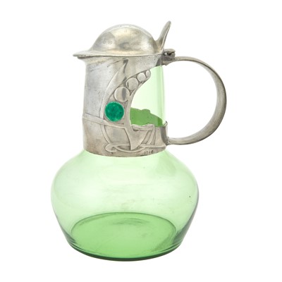 Lot 254 - Archibald Knox for Liberty & Co. Pewter and Enamel Mounted Glass Tudric Pattern Claret Jug