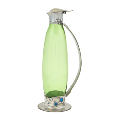 Lot 242 - Archibald Knox for Liberty & Co. Pewter, Enamel and Glass Tudric Pattern Claret Jug