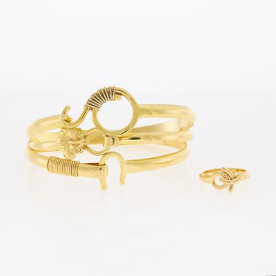 Lot 1230 - Sonya Three Gold Bangle Bracelets and Ring