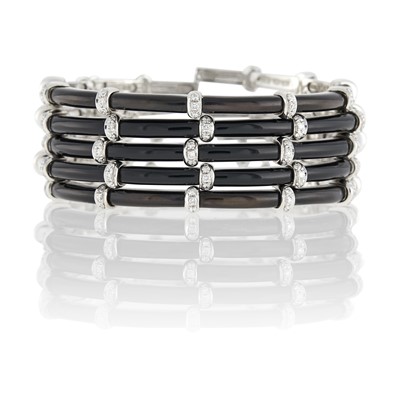 Lot 53 - Sidney Garber Five White Gold, Black Onyx and Diamond Bangle Bracelets
