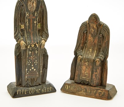 Lot 99 - Two Russian Carved and Painted Wood Figures of St. Nilus Stolobensky