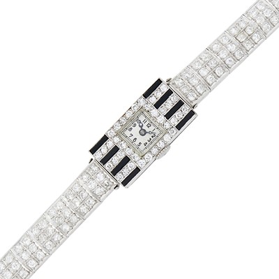 Lot 68 - Platinum, Diamond and Black Onyx Wristwatch