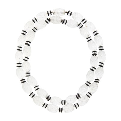 Lot 124 - Seaman Schepps Pair of Carved Rock Crystal, Black Onyx, White Gold and Diamond 'Torchon' Necklaces