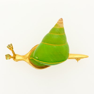 Lot 1129 - Gold, Enamel, Shell and Peridot Snail Brooch