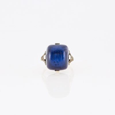 Lot 1078 - Platinum, Cabochon Synthetic Sapphire and Diamond Ring