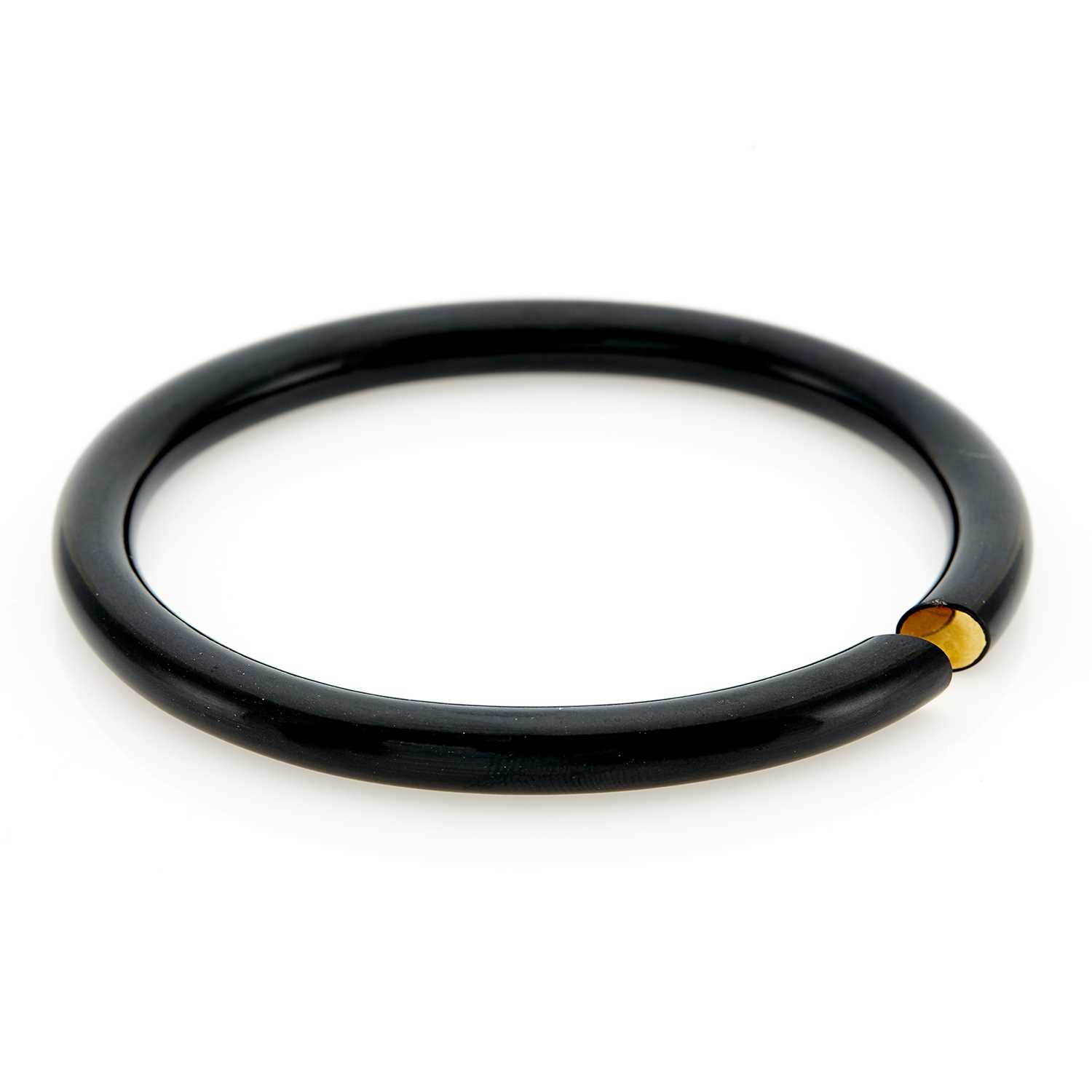 Lot 1039 - Black Jade and Gold Bangle Bracelet